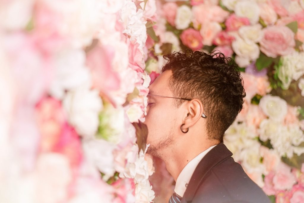 Man Smelling Flowers