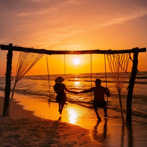 5 Types of Swingers man and woman on swingset at the beach at swinger resort