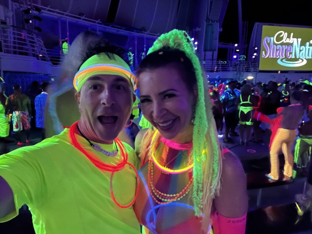 Ed and Phoebe in glow night costumes on the 2021 Bliss Cruise Swinger Cruise