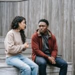 couple sitting on stairs having a conversation