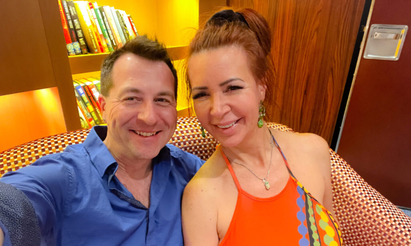 Ed & Phoebe sitting in the lounge on the Bliss Cruise