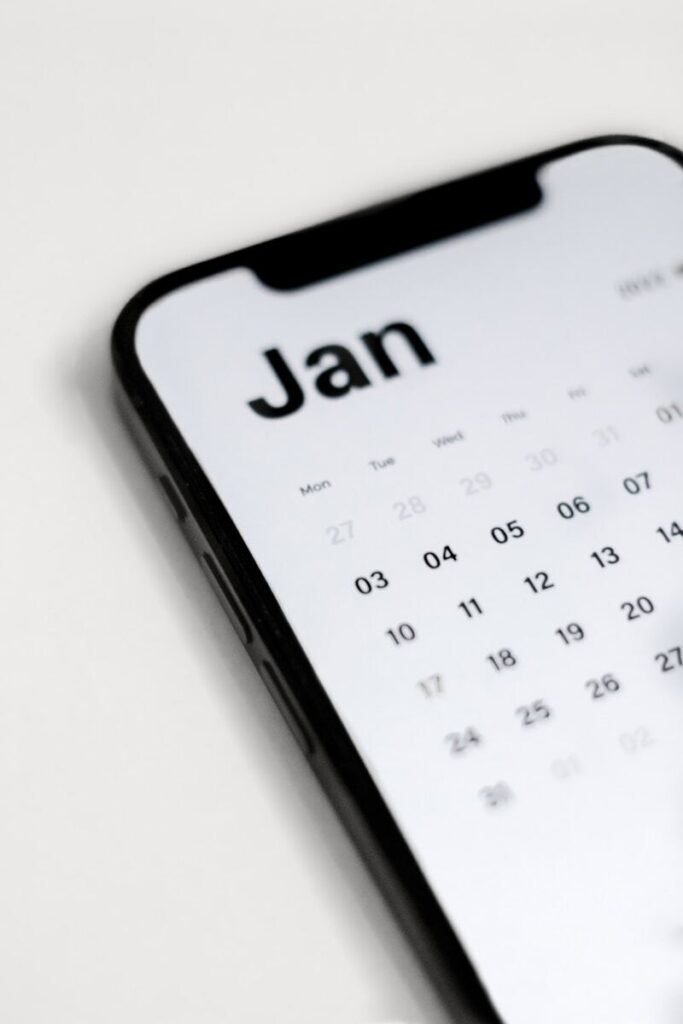 a close up of a cell phone with a calendar on it